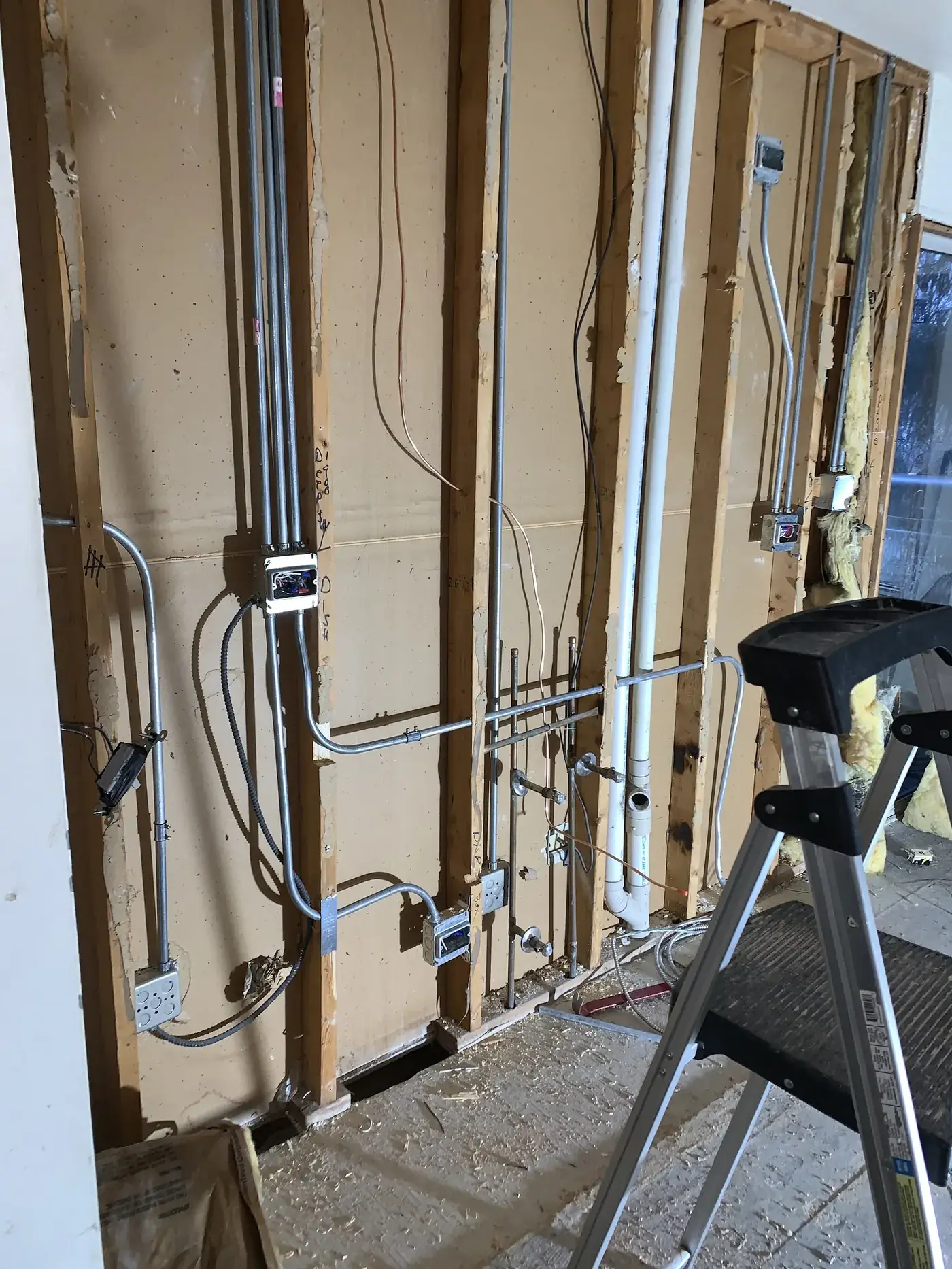 Electrical rough-in with multiple circuits exposed during a Naperville remodel