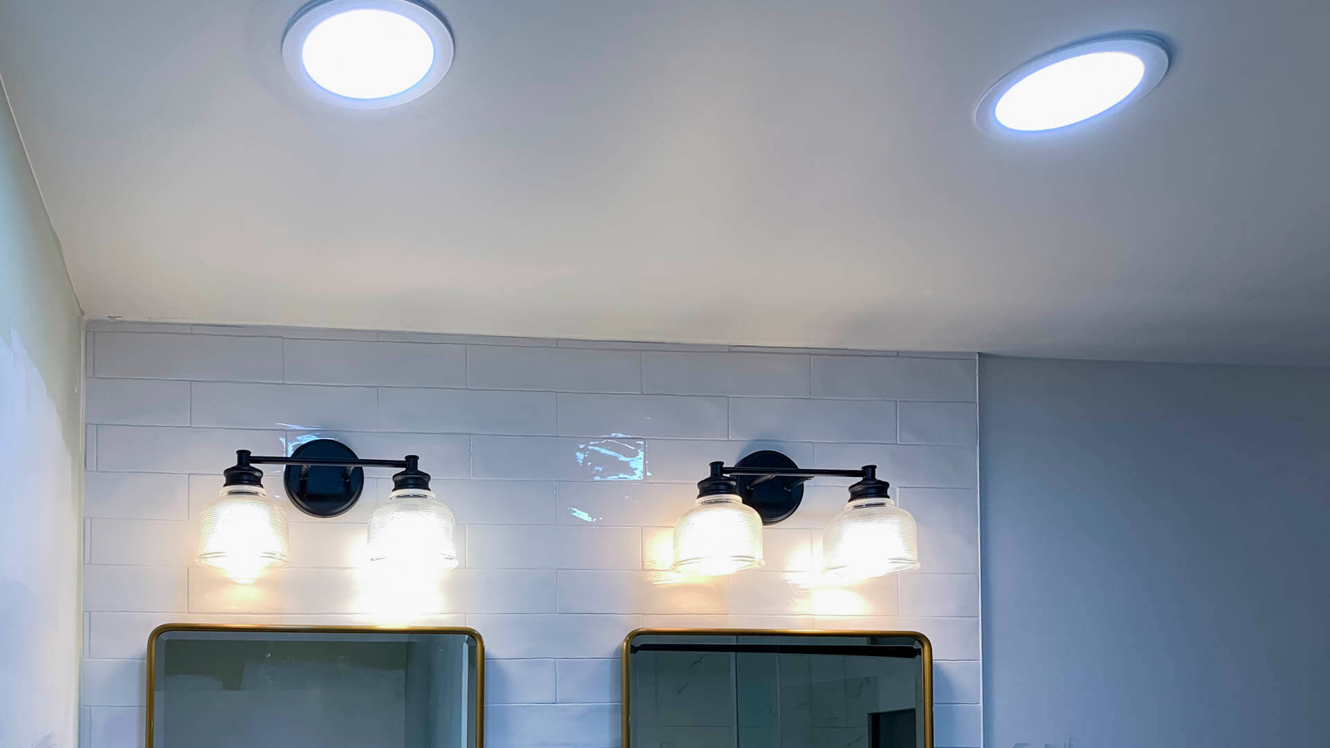 Bathroom dual vanity with pendant lighting installed by Tritan