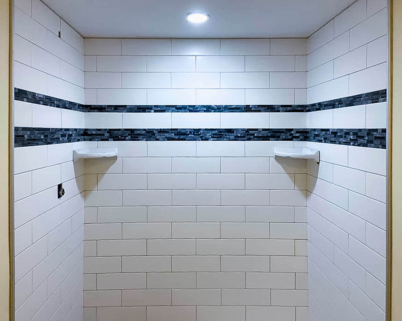 Recessed can lighting installed in a renovated bathroom