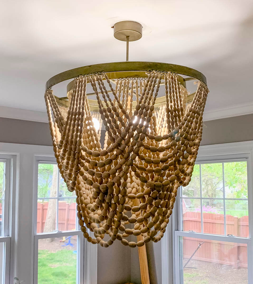 Beaded chandelier installed in a residential bay window by Tritan Services