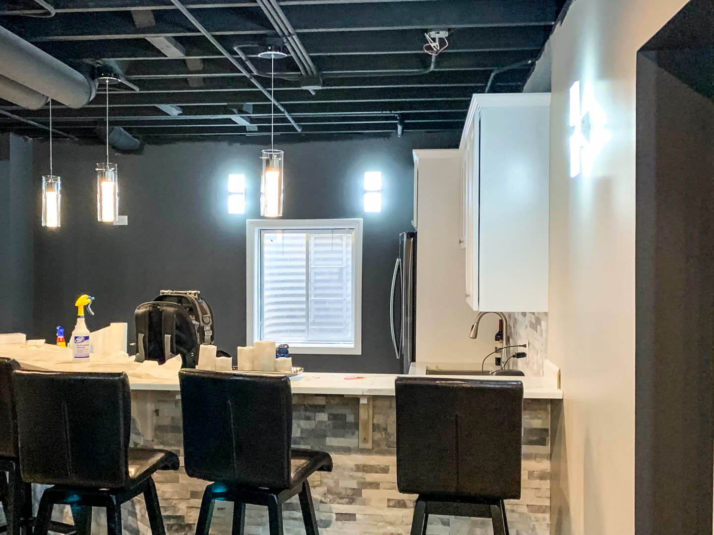 Kitchen pendant lighting installed in dark cabinet kitchen - Tritan Services