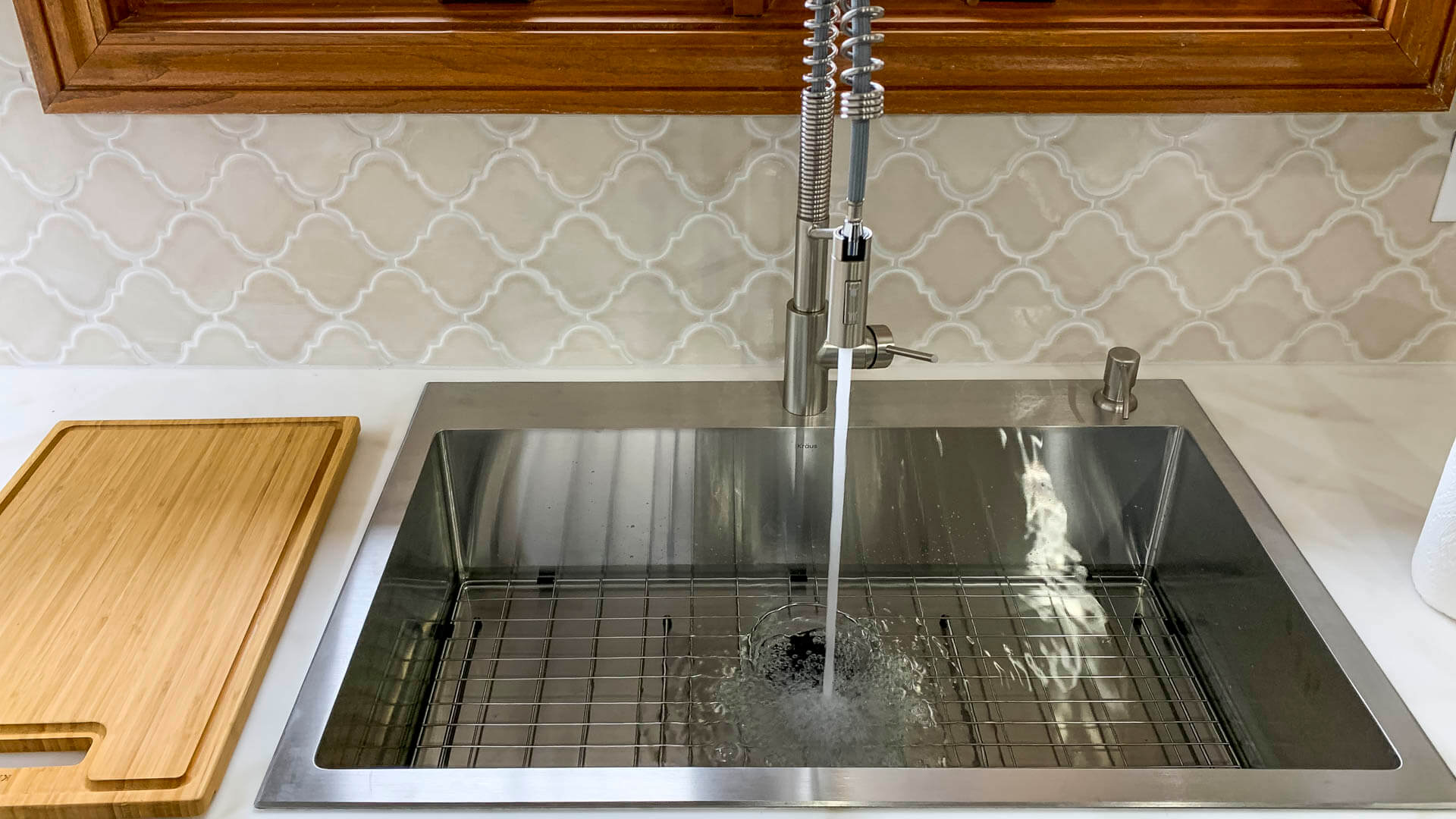 Stainless steel pull-down kitchen faucet installation by Tritan plumbers