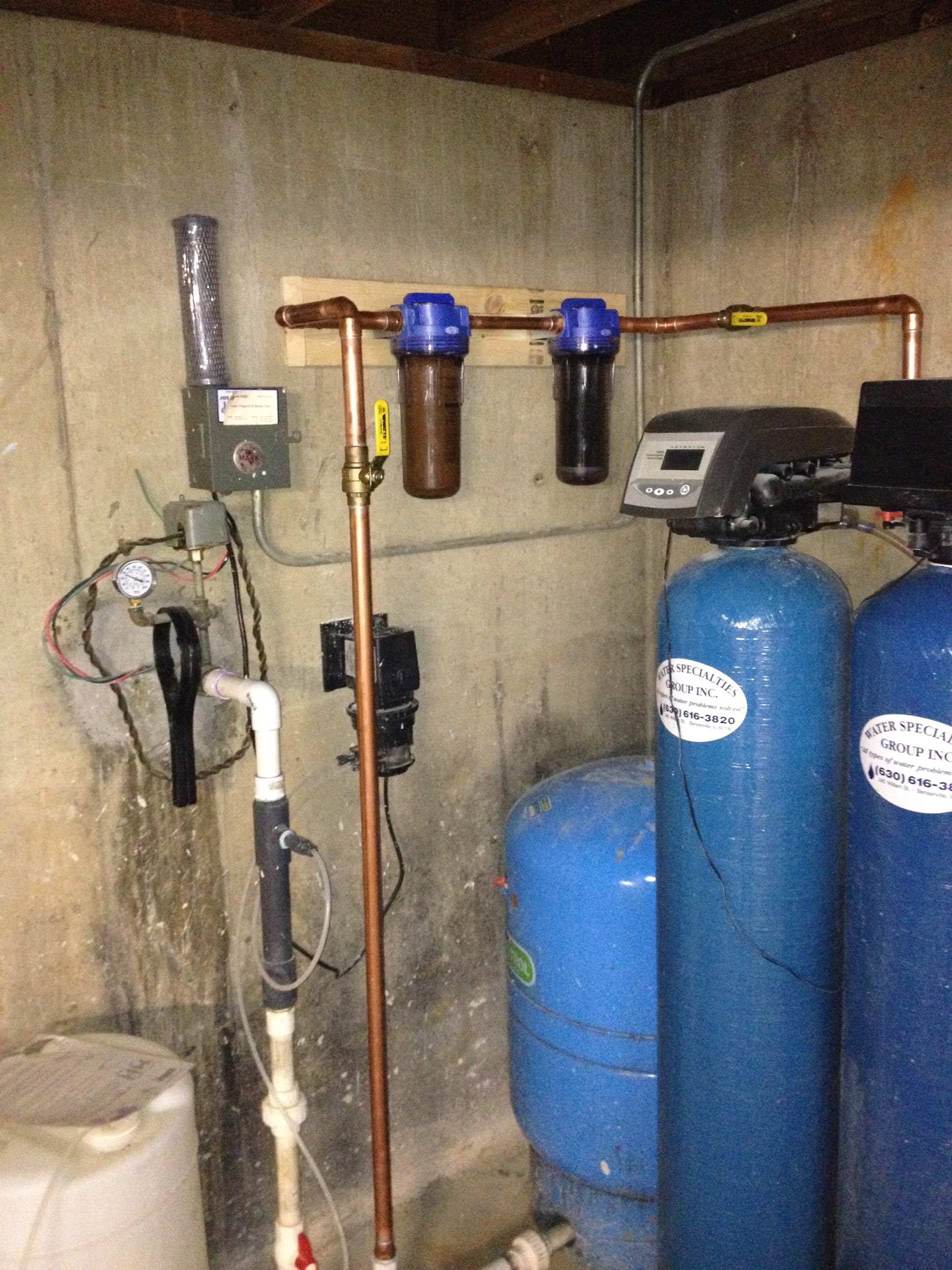 Water softener and filtration system installed by Tritan Services in Naperville basement